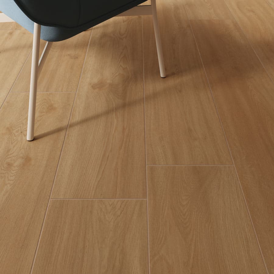Close-up of light wood flooring with visible grain patterns, beside a chair with white legs and a blue seat.