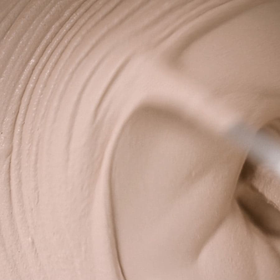Close-up of Fugabella Living, smooth, mousse texture, with visible ridges and a soft, creamy appearance.